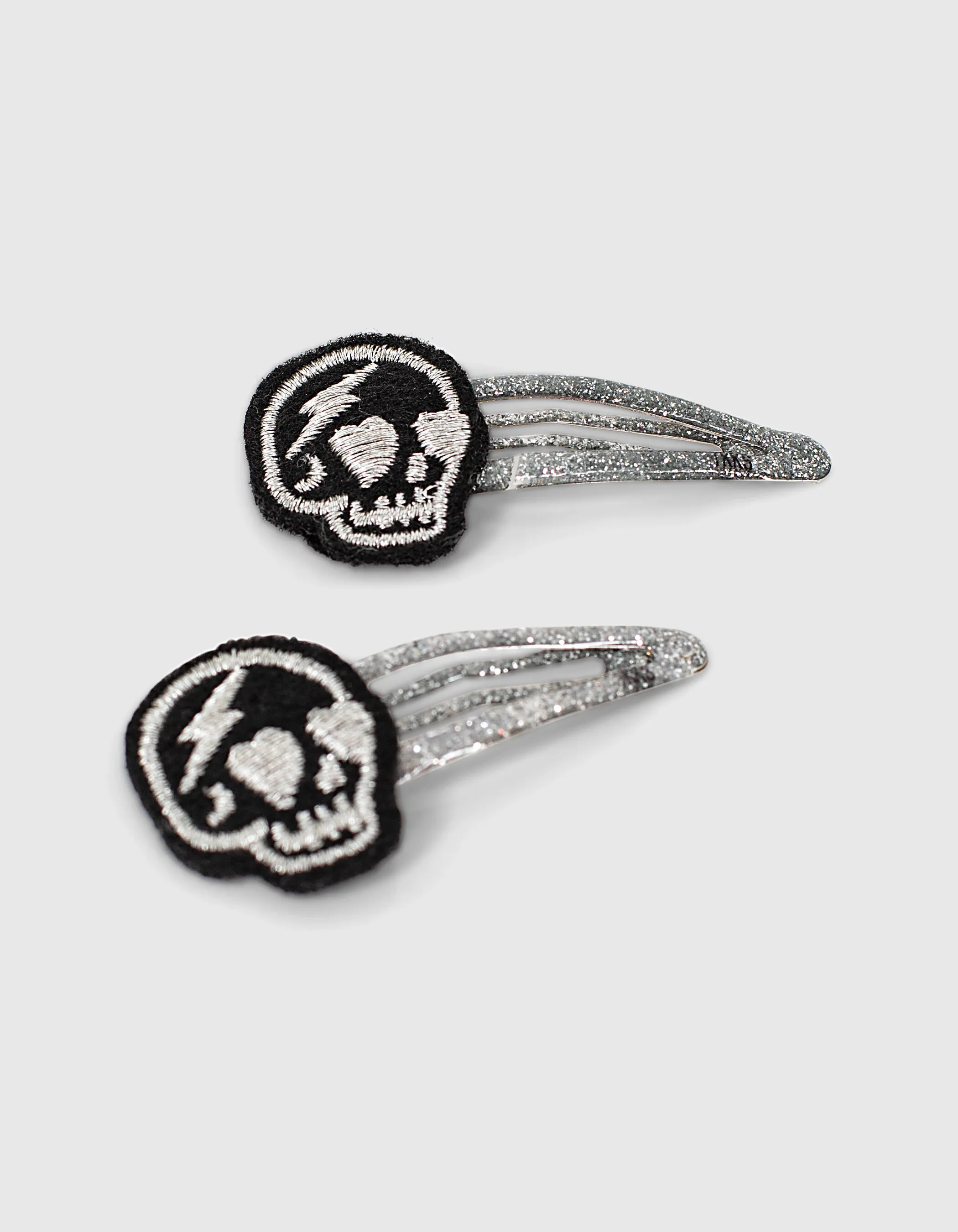 Barrettes dusty rose à étoiles et grises à skulls fille